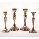 A pair of silver candlesticks, Birmingham 1960, weighted,