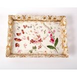 A rectangular porcelain tray, circa 1830, with pierced rim, painted with sprigs of summer flowers,