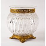 A cut glass vase with pierced gilt metal mounts on anthemion feet,