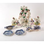 A group of Staffordshire figures including a watch stand and spill vases and five blue and white