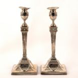 A pair of George III silver candlesticks, maker indistinct, London 1784,