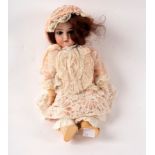 An Armand Marseille bisque head doll, marked 390 14/0 x M, with sleepy eyes, open mouth with teeth,