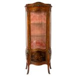 A French kingwood vitrine of serpentine outline with gilt metal mounts,