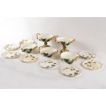 A Coalport part dessert service, circa 1840, moulded with trailing ivy,