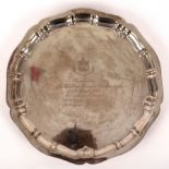 A silver salver, Chester 1912, with pie crust rim and presentation inscription, 33cm diameter,