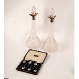 A pair of Edwardian silver mounted glass decanters and stoppers,