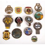 A small quantity of car badges including AA, RAC, International Motorcyclists Tour Club,