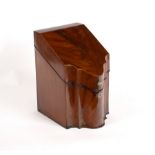 An early 19th Century mahogany knife box with serpentine front and fitted interior,