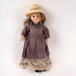 An Armand Marseille 390n bisque head doll with sleepy eyes, open mouth with teeth,
