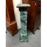 A faux marble plinth, square with green veined decoration,