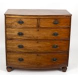 A 19th Century mahogany bowfront chest of two short over three long drawers, on reeded feet, 104.