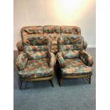 An Ercol sofa and two matching chairs, circa 1970,