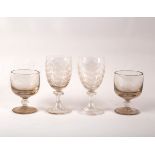 A pair of wine glasses etched with leaves and a pair of rummers
