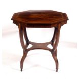 An Edwardian rosewood octagonal table with under tier, both decorated a circular floral inlay,
