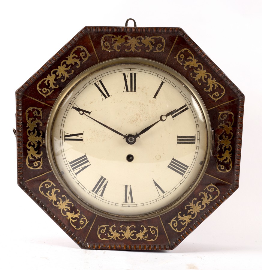 A Regency brass inlaid octagonal wall clock with painted dial, fitted a single fusee movement,