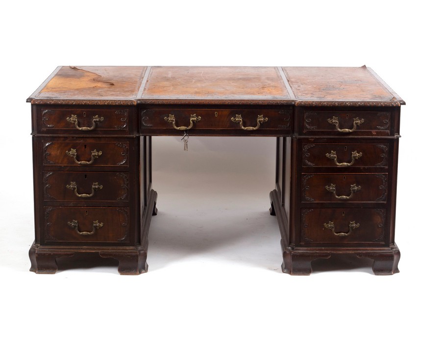 A 19th Century pedestal desk, with inset leather top, fitted a surround of nine drawers,