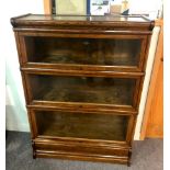 A Globe Wernicke oak bookcase with three glass fronted sections,