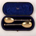 A pair of Victorian silver and silver gilt serving spoons, Hilliard & Thomason, Birmingham 1890,