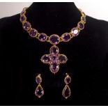 An early 19th Century amethyst necklace and matching ear pendants,