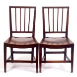 A pair of 19th Century fruitwood stick back chairs with solid seats on square taper legs