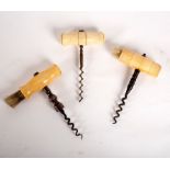 A steel corkscrew with ivory handle and brush,