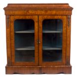 A Victorian walnut and inlaid display cabinet with gilt metal mounts,