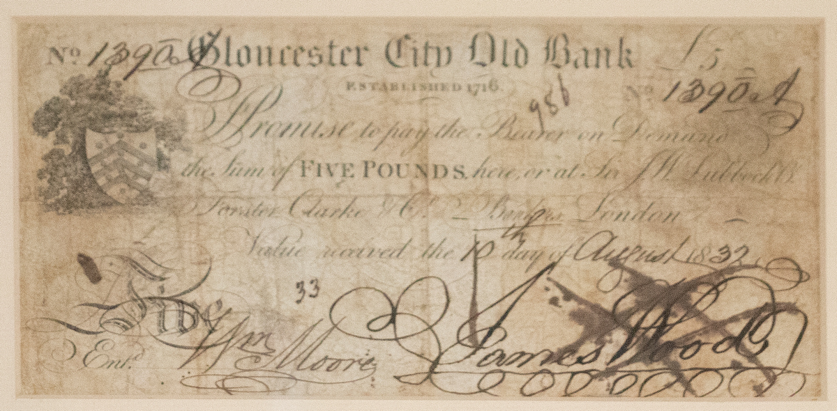 LOT WITHDRAWN A Gloucester City Old Bank five pound note No 1390, signed by Jemmy Wood,