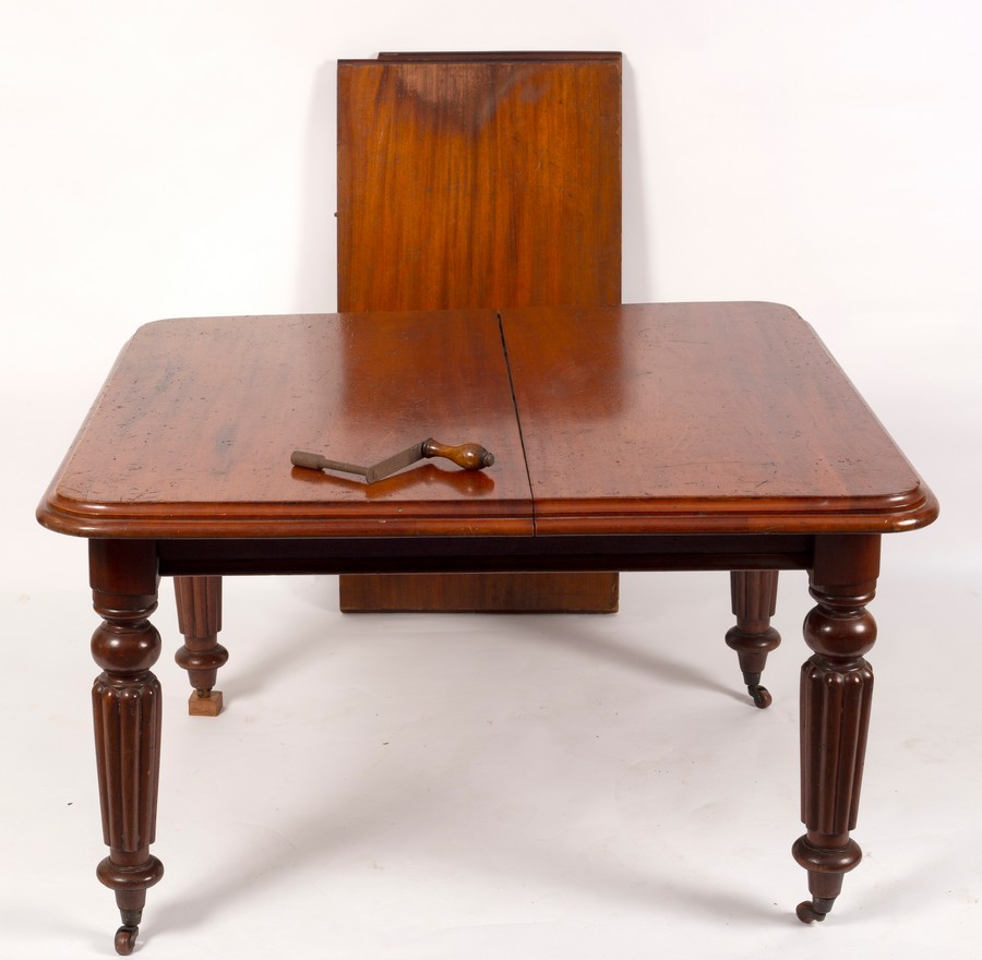 A Victorian mahogany extending table on tapering fluted legs, with extra leaf and winder, - Image 2 of 2