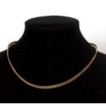 An 18ct tri-colour gold necklace of flattened textured links, approximately 26.