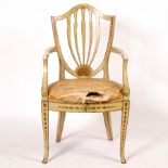A late 18th Century Hepplewhite style chair with upright splats to the shield-shaped back,