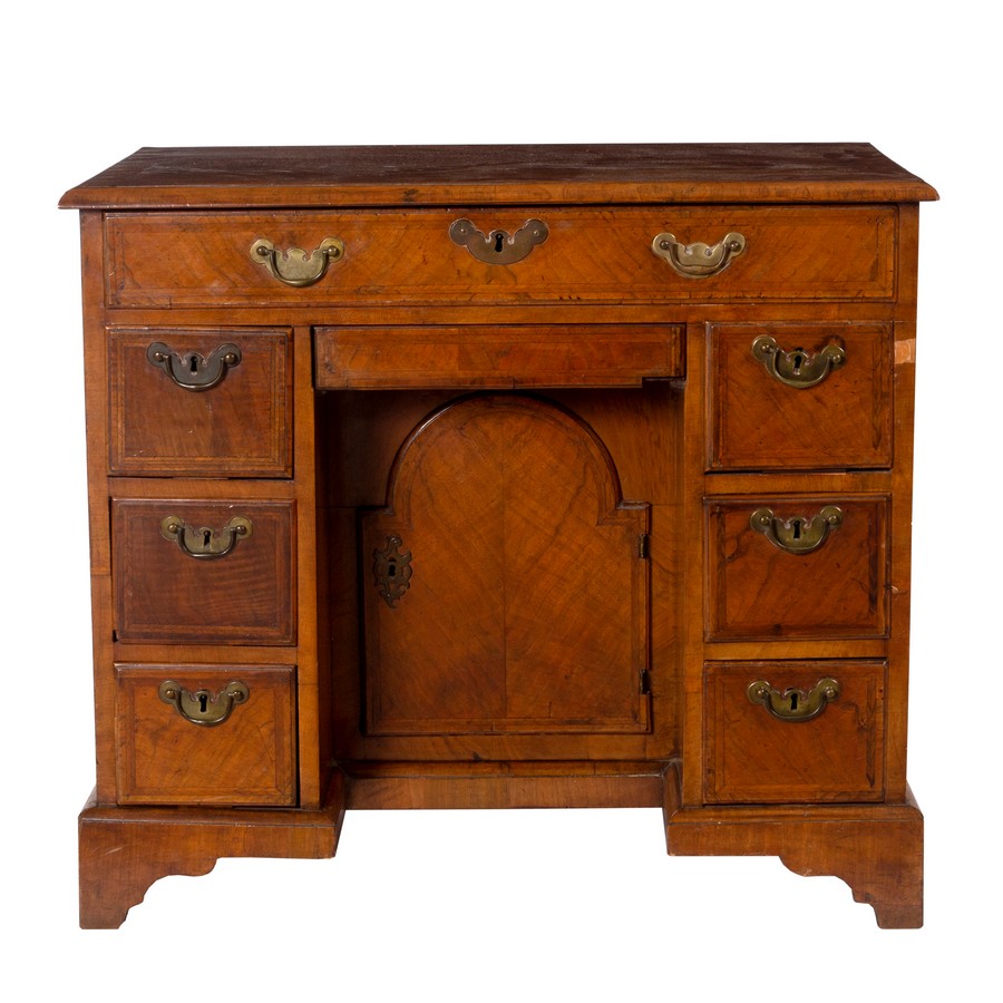 A George I style walnut veneer kneehole writing desk, circa 1720,