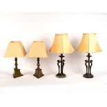 A pair of Art Deco style table lamps on panther mask monopodia supports,