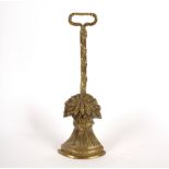 A brass door porter in the form of a wheat sheaf,