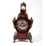 A 19th Century French tortoiseshell and gilt metal mounted mantel clock with C-scroll decoration,
