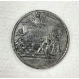 A medal commemorative of Oliver Cromwell by J Daniel, laureate and draped bust left,