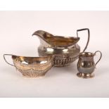 A George III silver cream jug, Guest & Craddock, London 1808, part gadrooned, 15cm high,