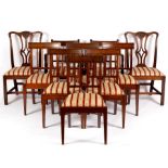 A set of eight 19th Century mahogany rail back dining chairs, with trap seats,
