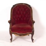 A Victorian mahogany armchair with button back,