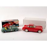 A Voiture de Course racing car and a red painted coupe,