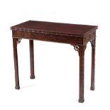 A Chinese Chippendale style card table with blind fret carved frieze on fret carved square