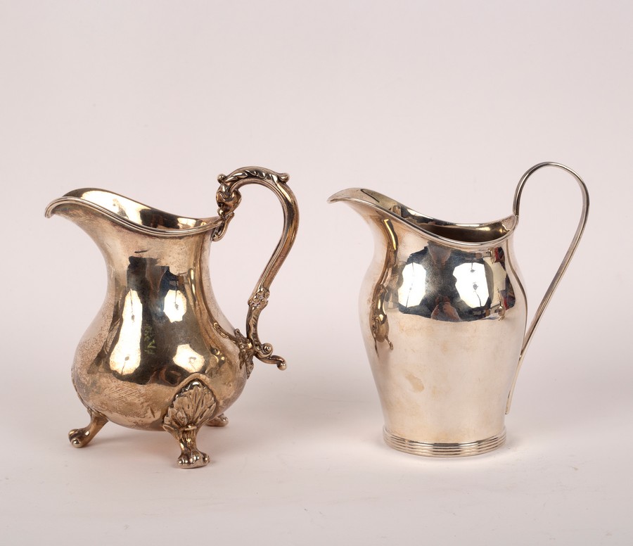 A Victorian silver baluster cream jug, London 1855, 11cm high and another, George Unite,