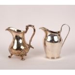 A Victorian silver baluster cream jug, London 1855, 11cm high and another, George Unite,