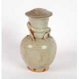 A Chinese celadon glazed vase and cover, Yuan dynasty, with applied kylin to the neck,
