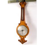 A Regency oak wheel barometer with thermometer by Negretti & Zambra 103cm high