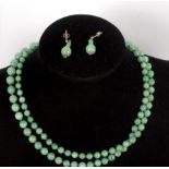 A single row of graduated jade beads, with a paste set clasp,