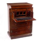A Victorian mahogany Wellington chest, fitted a secretaire drawer disguised as two dummy drawers,