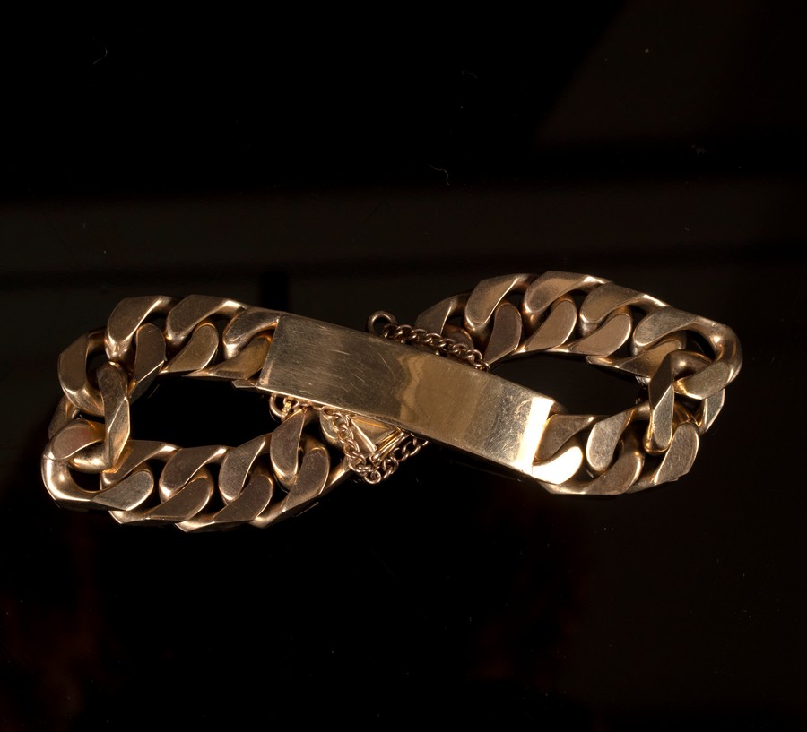 A gentleman's 9ct gold bracelet of flattened curb links with central rectangular plaque, - Image 2 of 2