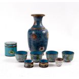A cloisonné vase of baluster shape, decorated flowers to a blue ground, 26cm high,