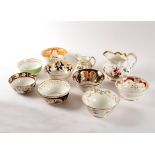 Eight English porcelain slop bowls and two jugs, circa 1800-1860,