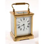 A French gilt brass hour repeat eight-day carriage clock in a gilt brass rectangular squat case,